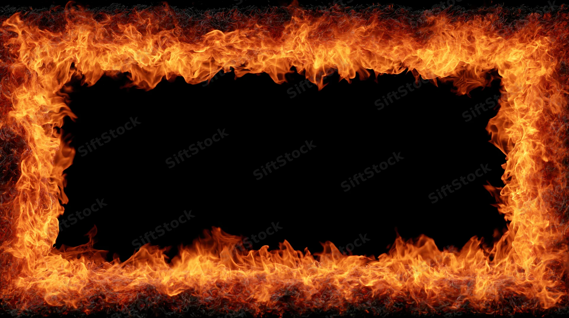 Rectangular frame of intense fire flames forming a border around a black copyspace