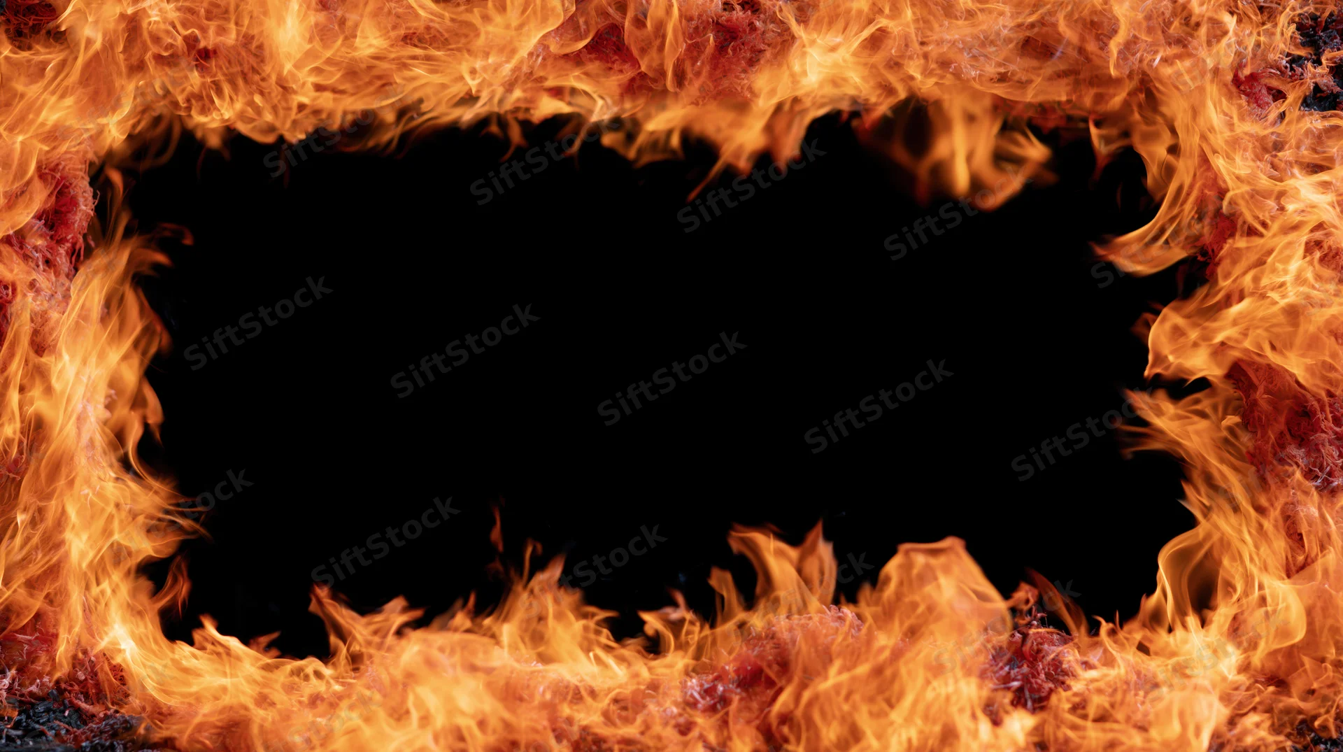 Rectangular frame of intense fire flames forming a border around a dark void