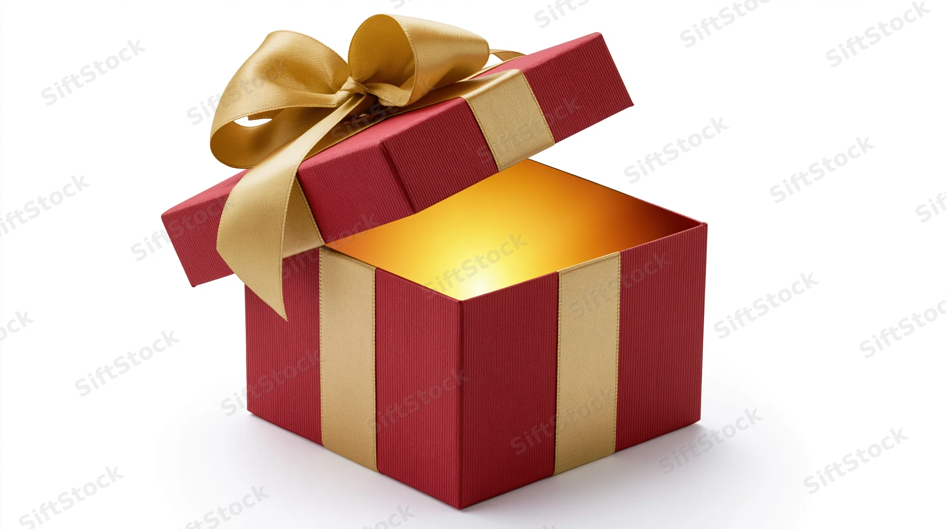 Open red gift box with gold ribbon and glowing light inside on white background