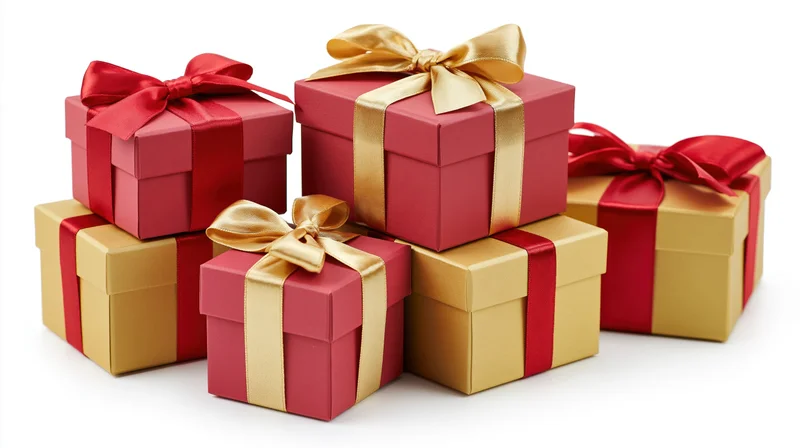 Six red and gold gift boxes wrapped with ribbons and bows arranged in a staggered stack on a white background