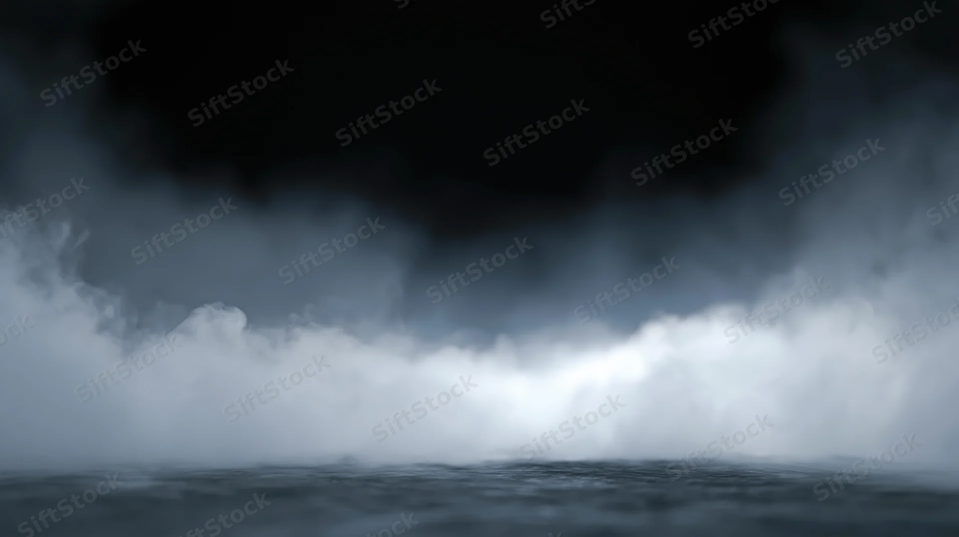 Thick white smoke rolling low across a dark studio floor