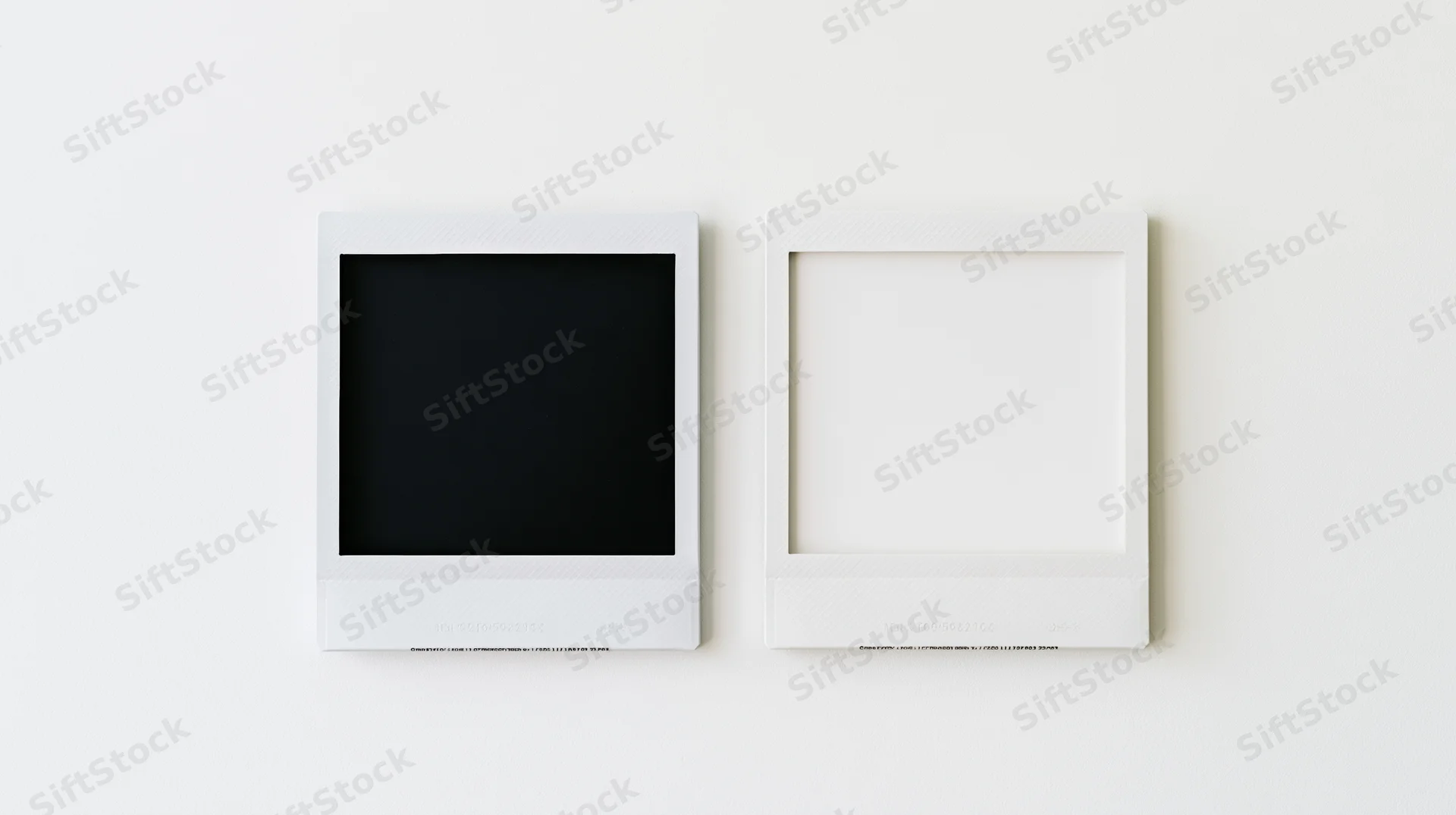 Two white polaroid photo frames side by side on a plain white surface