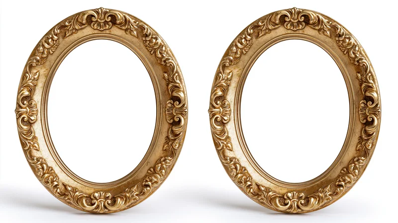 Two ornate oval gilded picture frames with baroque carved floral details side by side on white background