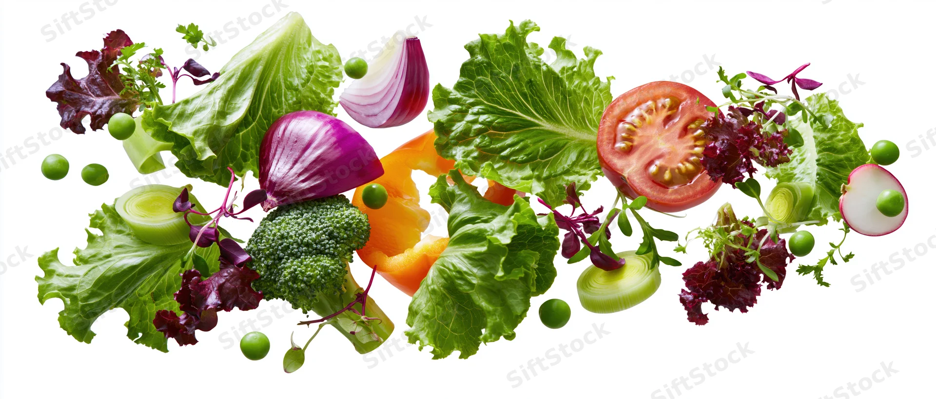 Fresh salad vegetables floating midair in dynamic spread across frame