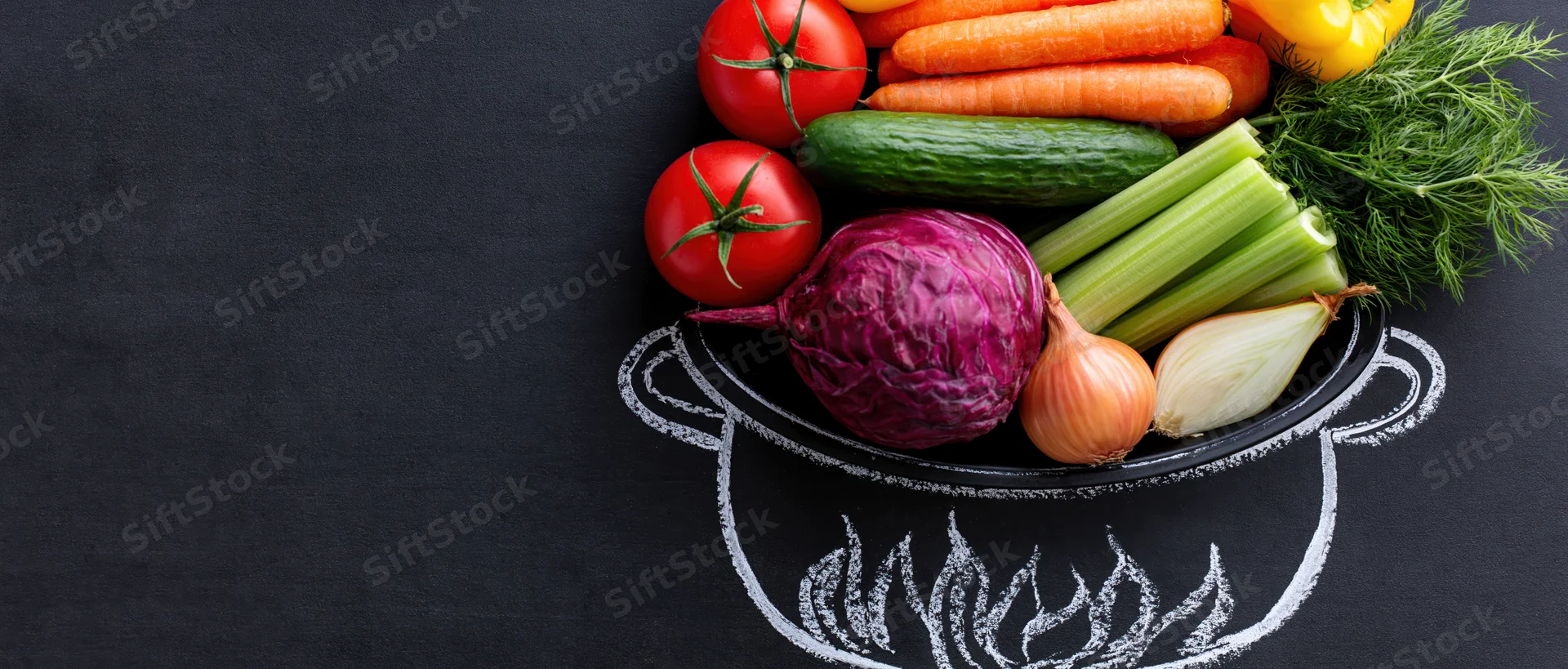 Fresh vegetables arranged in a chalk-drawn pot on a blackboard surface