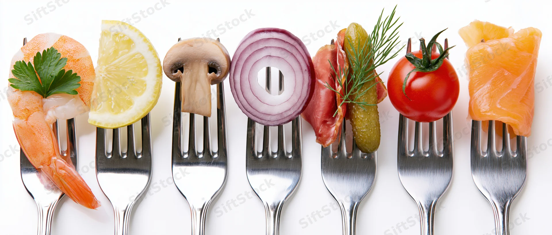 Seven forks each holding a different food item arranged in a row on a white surface