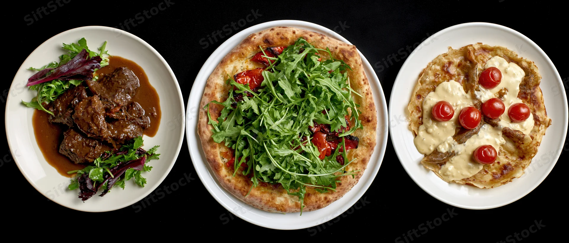 Three restaurant dishes arranged in a row on white plates against a black background