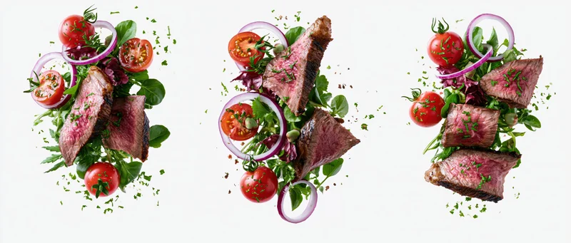 Three variations of beef steak salad with tomatoes onions and greens arranged overhead on white background