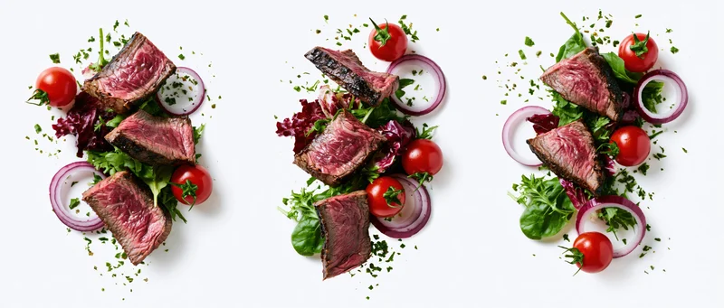 Three variations of beef steak salad arranged on white background with cherry tomatoes, red onion, greens and herbs