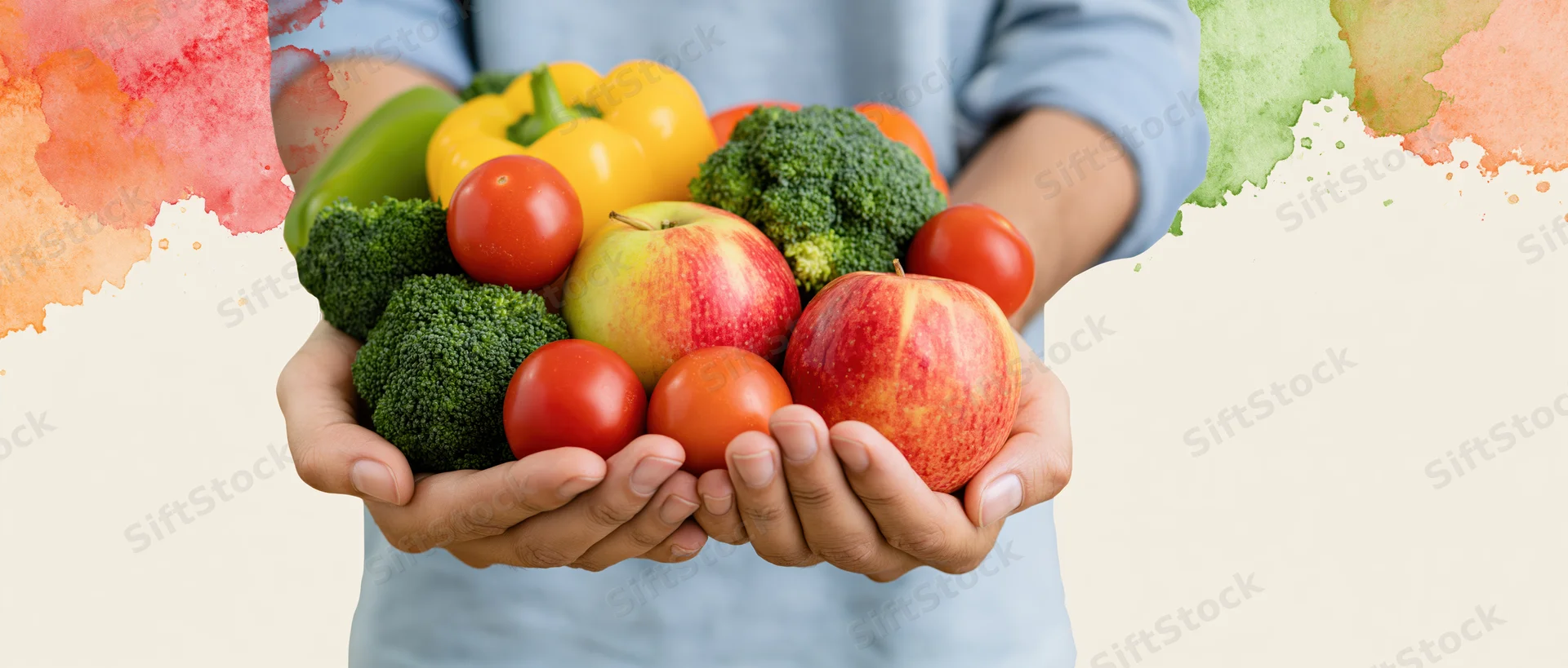 Hands cupping a mix of fresh fruits and vegetables against a light background with watercolor accents