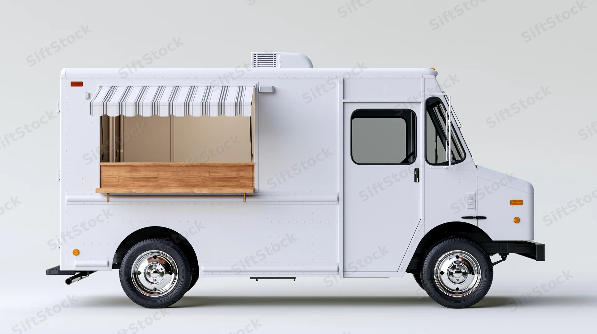 White food truck parked and viewed from side with service window and striped awning