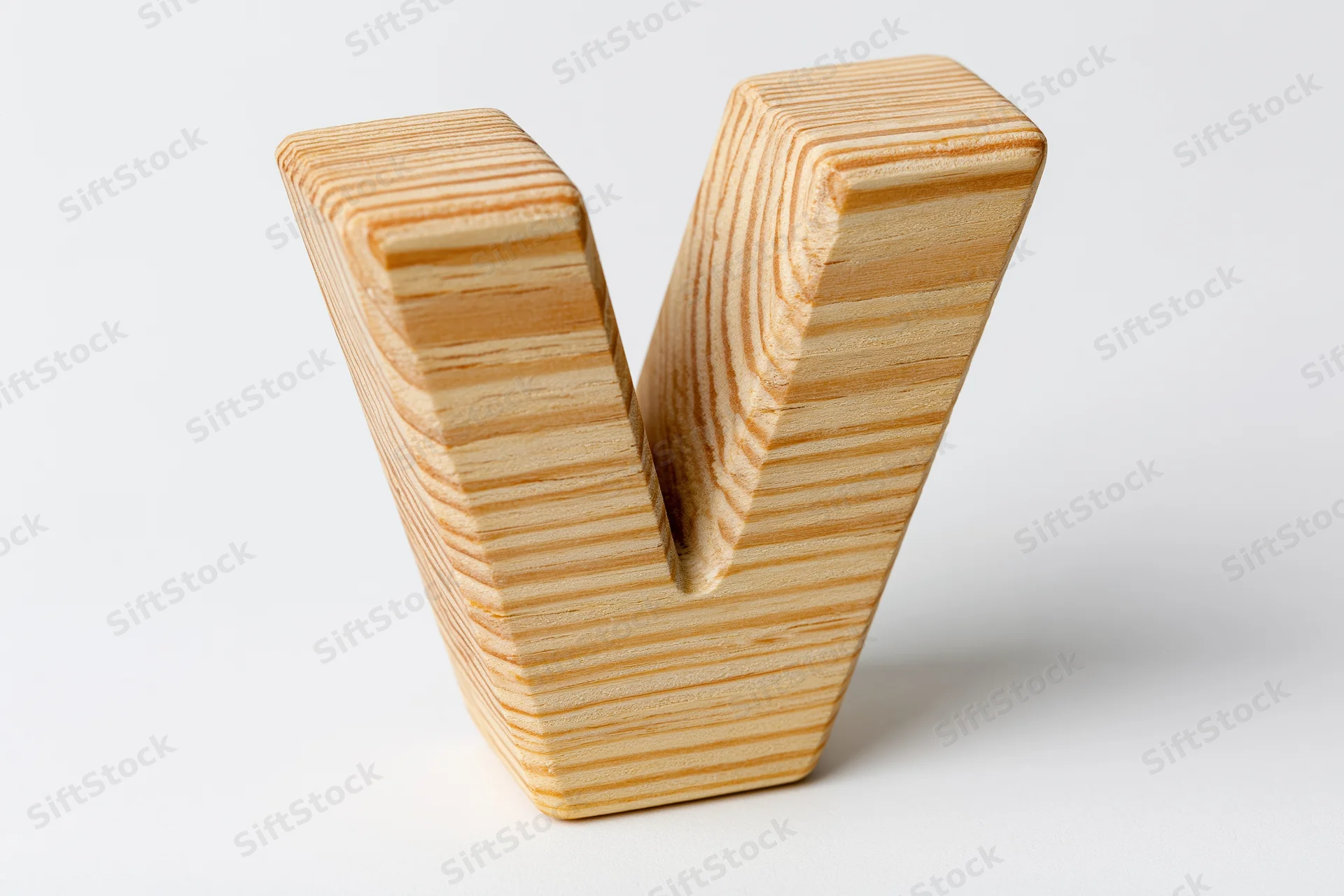 Wooden letter v block toy isolated on white background