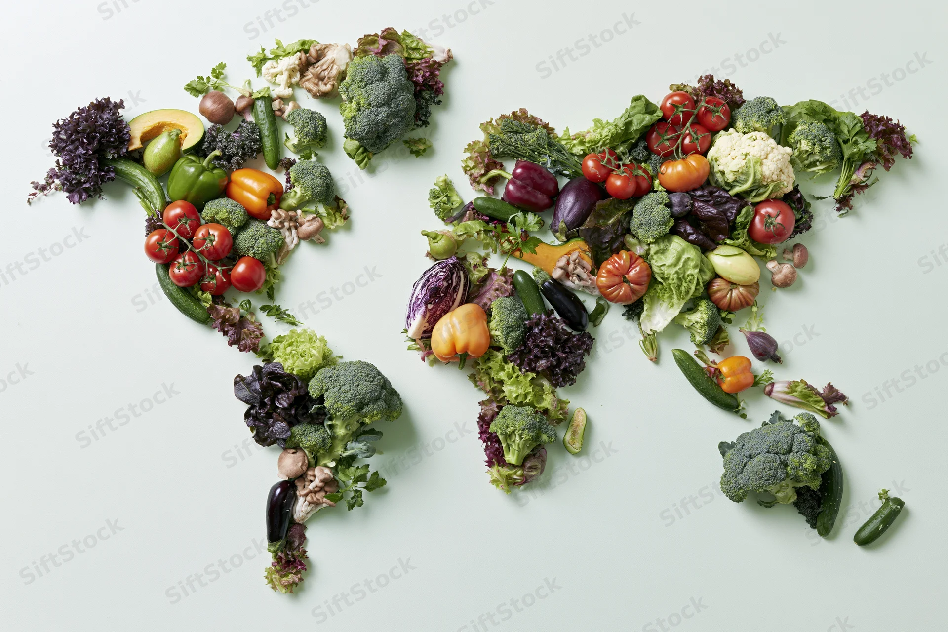 World map made from fresh vegetables arranged on white surface