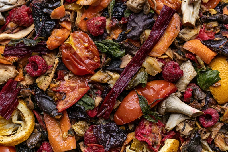Closeup of mixed vegetable and fruit scraps piled together for composting