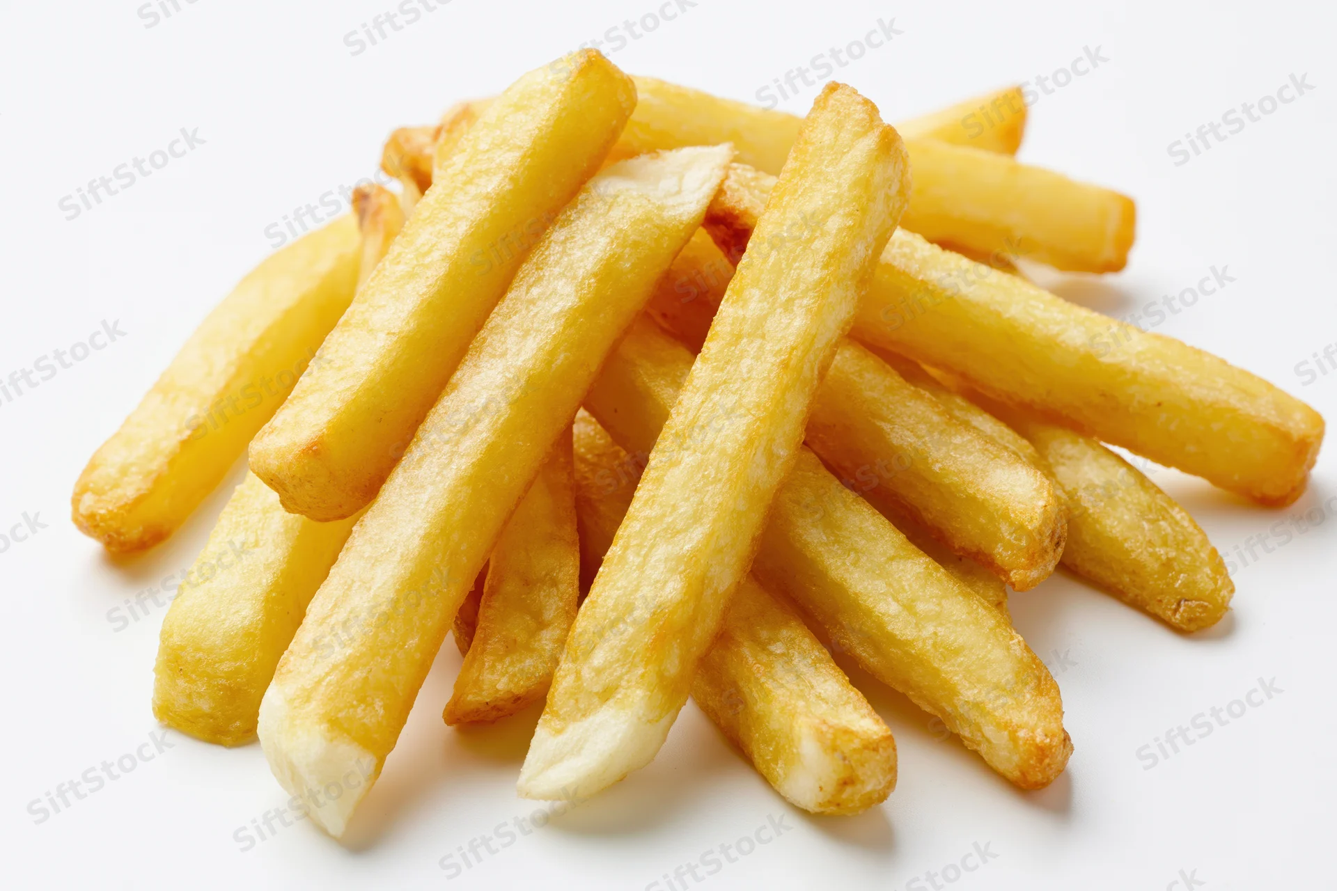 Pile of golden french fries on white background