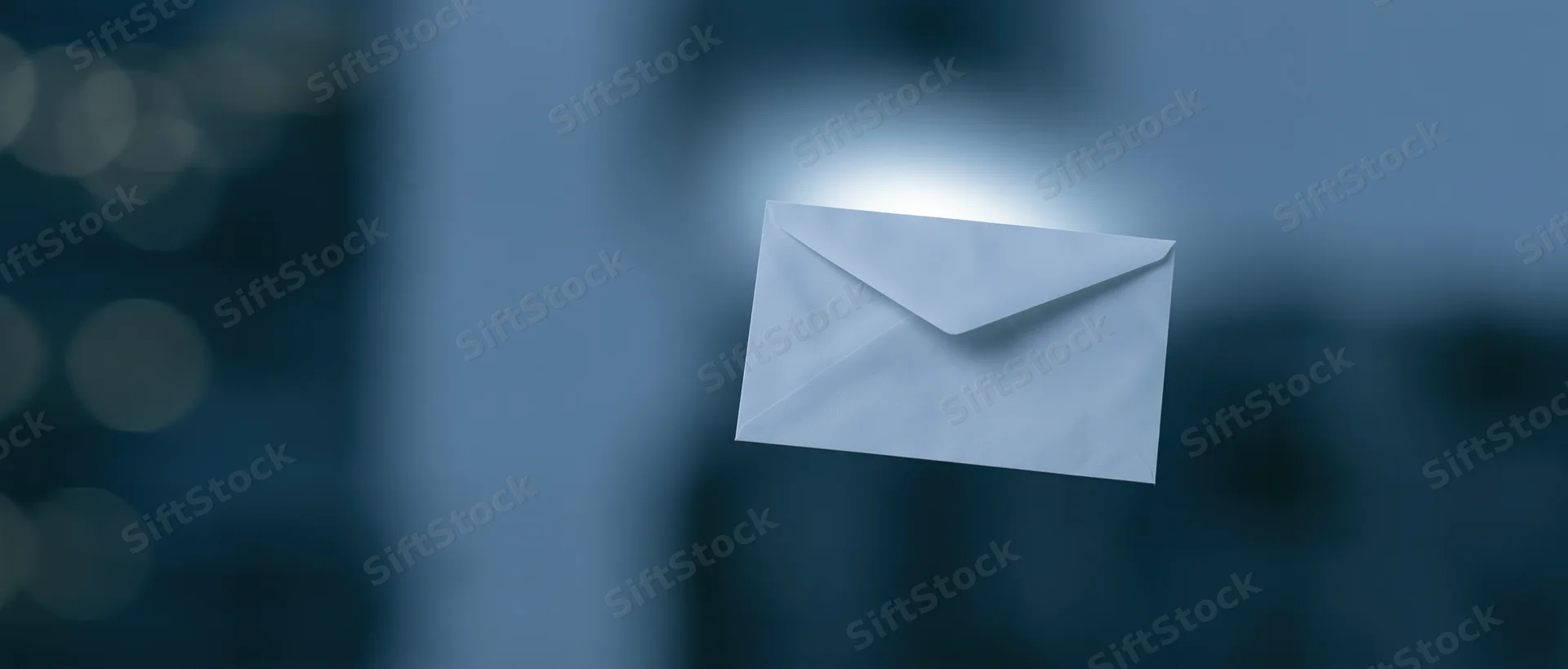 White paper envelope floating in digital space with soft glow