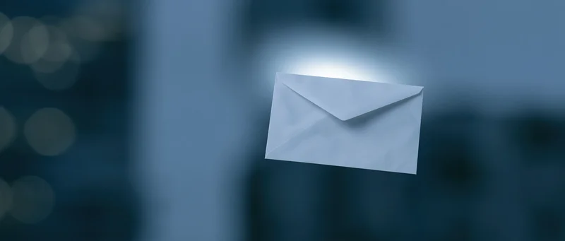 White paper envelope floating in digital space with soft glow
