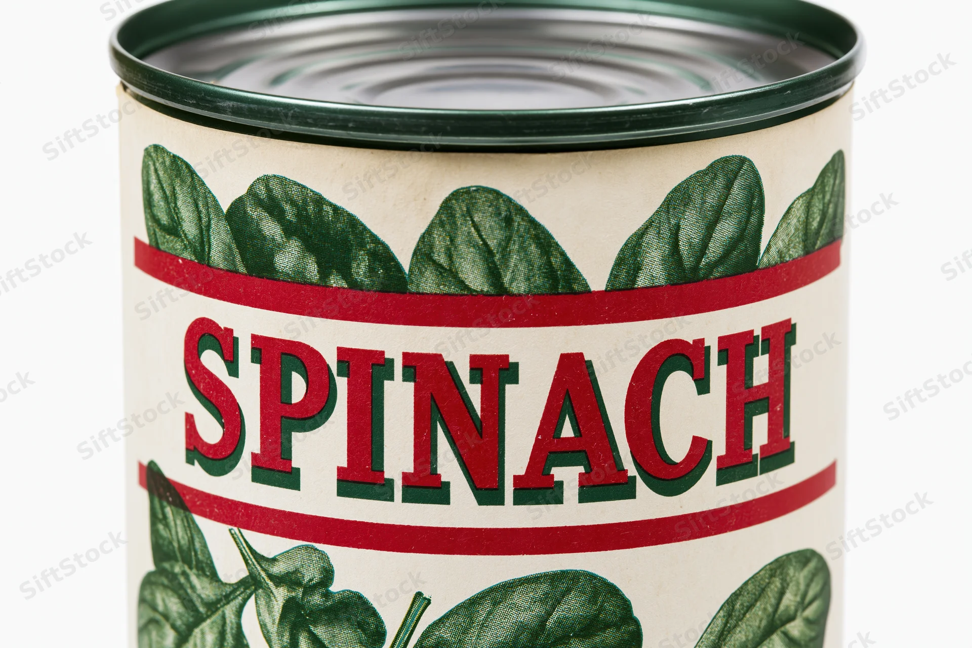 Vintage-style canned spinach tin with paper label featuring green leaves and red text on white background