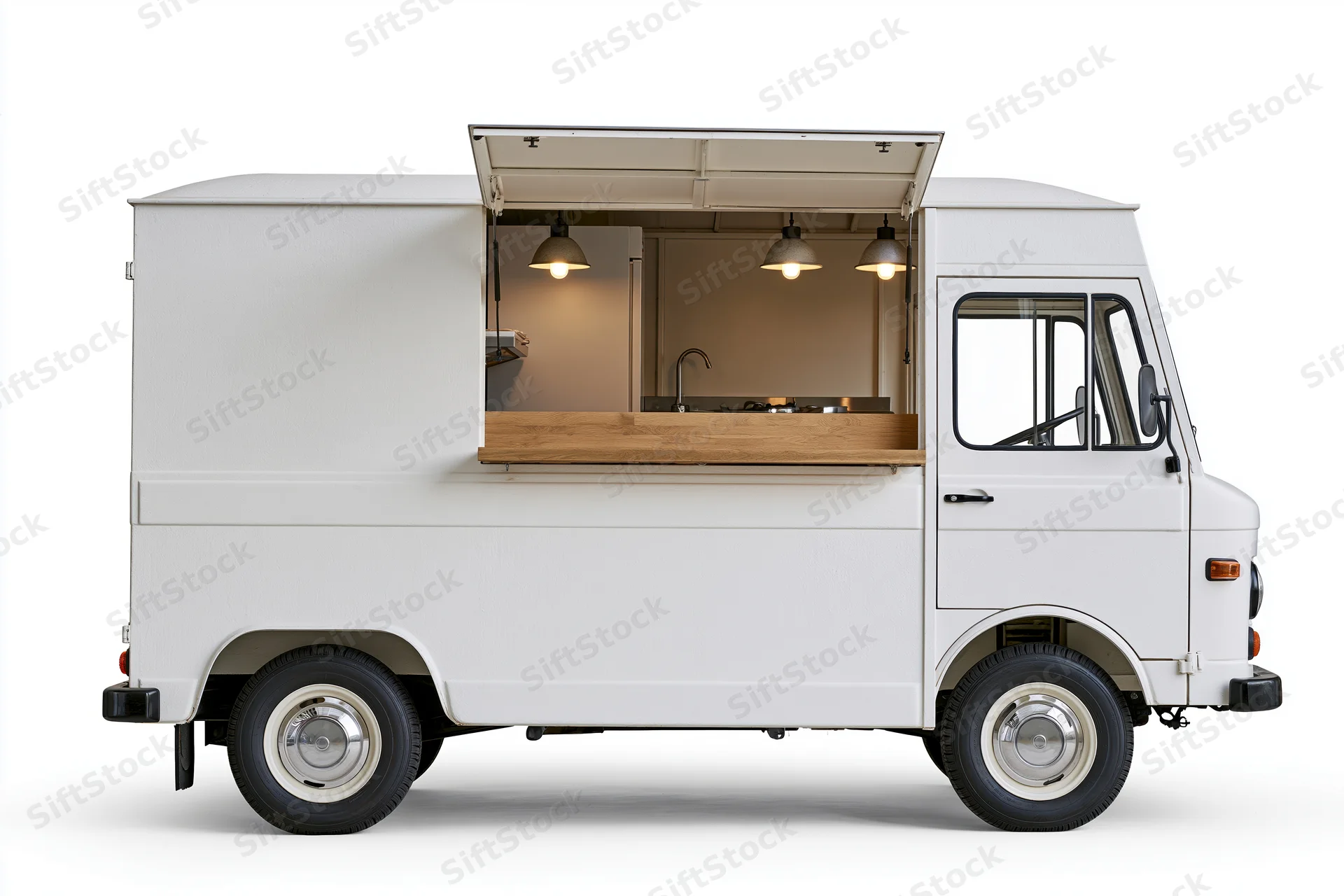 Vintage-style white food truck van with serving window and kitchen interior visible