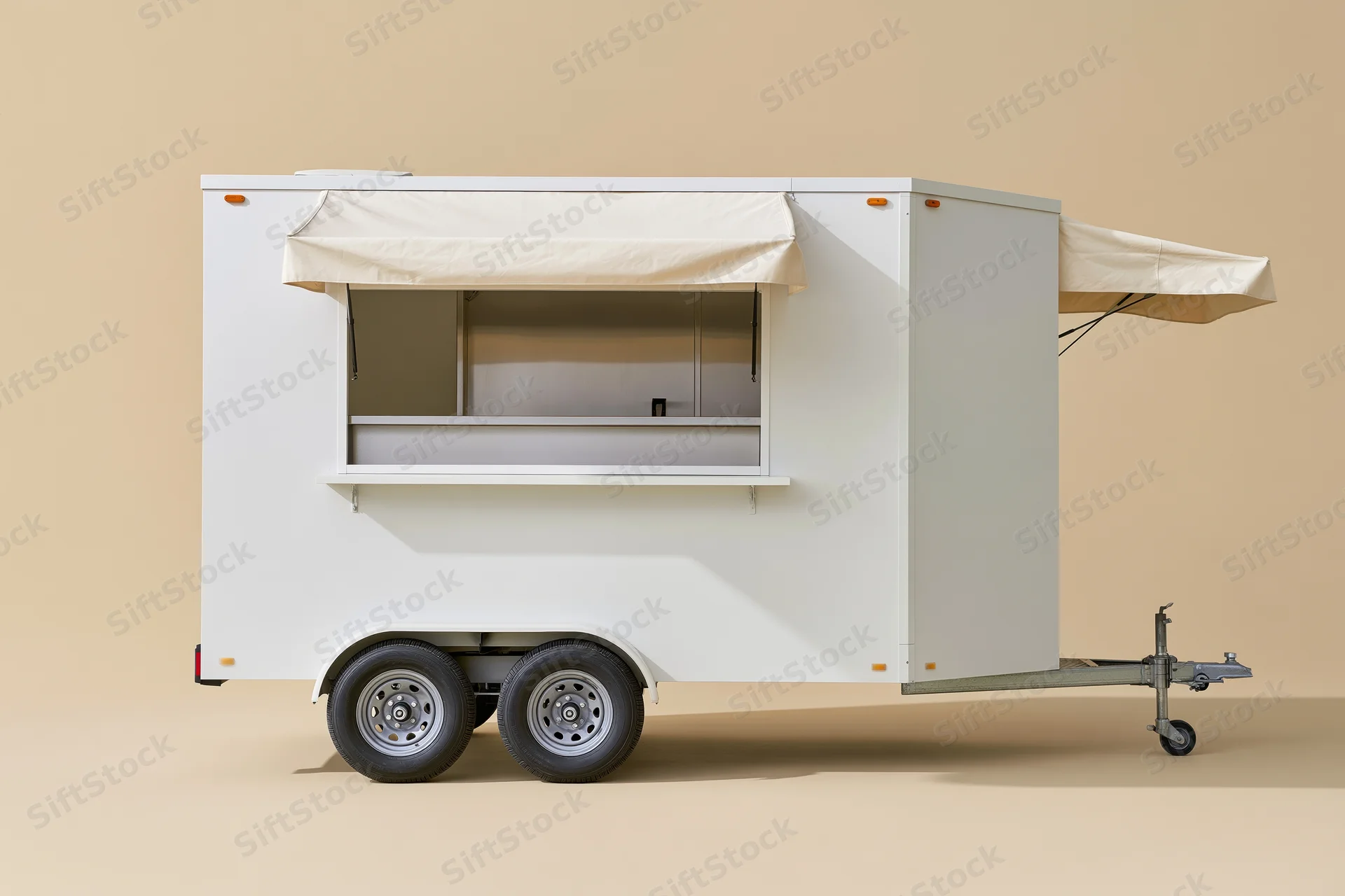 White food trailer with open service window and extended awning on plain background