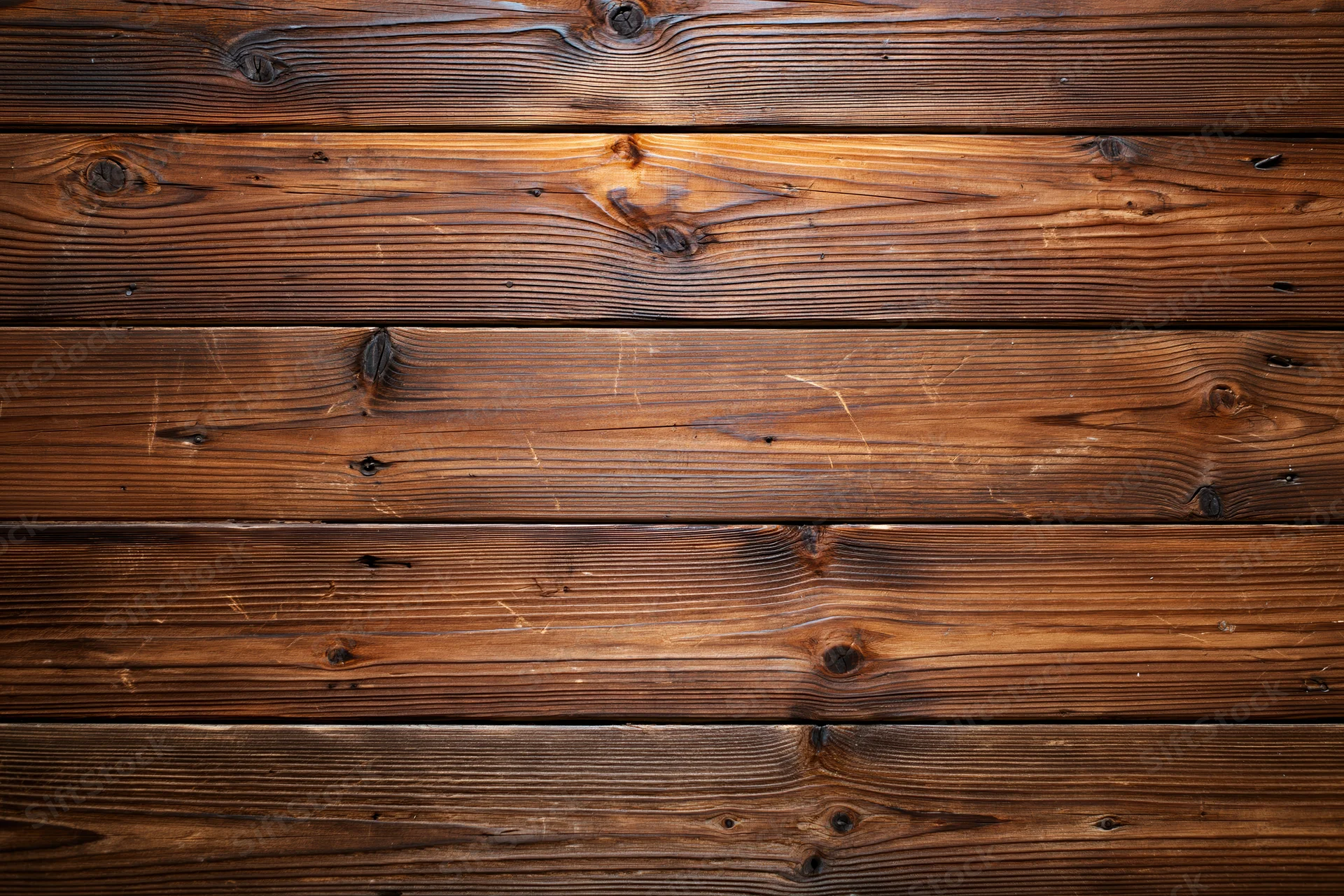 Horizontal aged wood planks filling the frame as a textured surface
