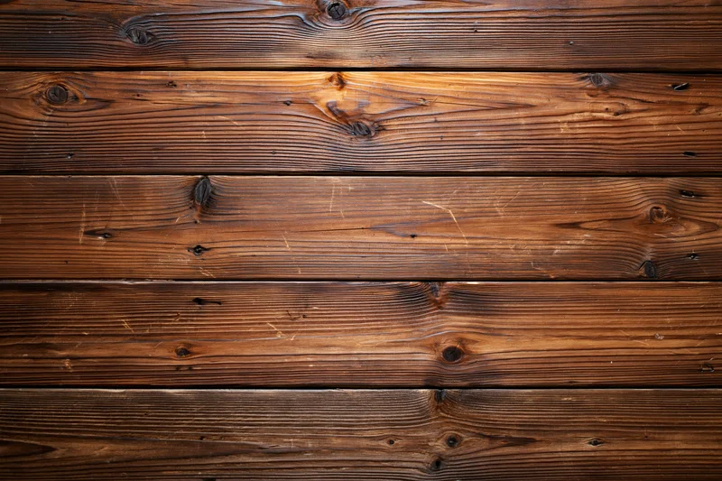 Horizontal aged wood planks filling the frame as a textured surface