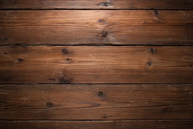 Horizontal aged wood planks filling the frame as a textured surface