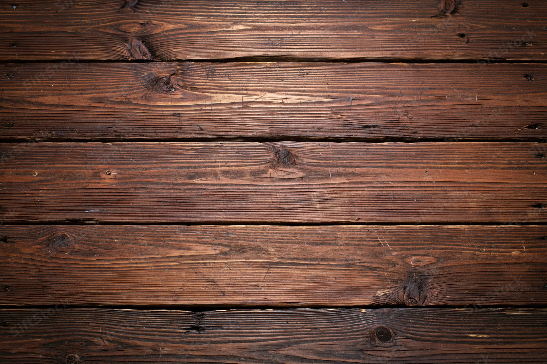 Horizontal aged wood planks filling the frame as a textured surface
