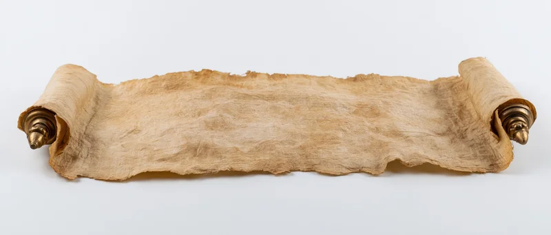 Ancient parchment scroll fully unrolled horizontally on white background