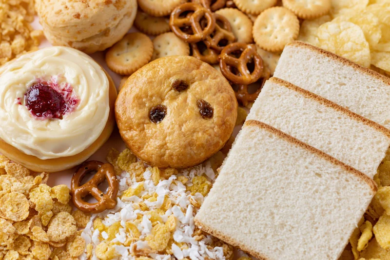 Assorted processed snack foods arranged in a flat lay overhead view