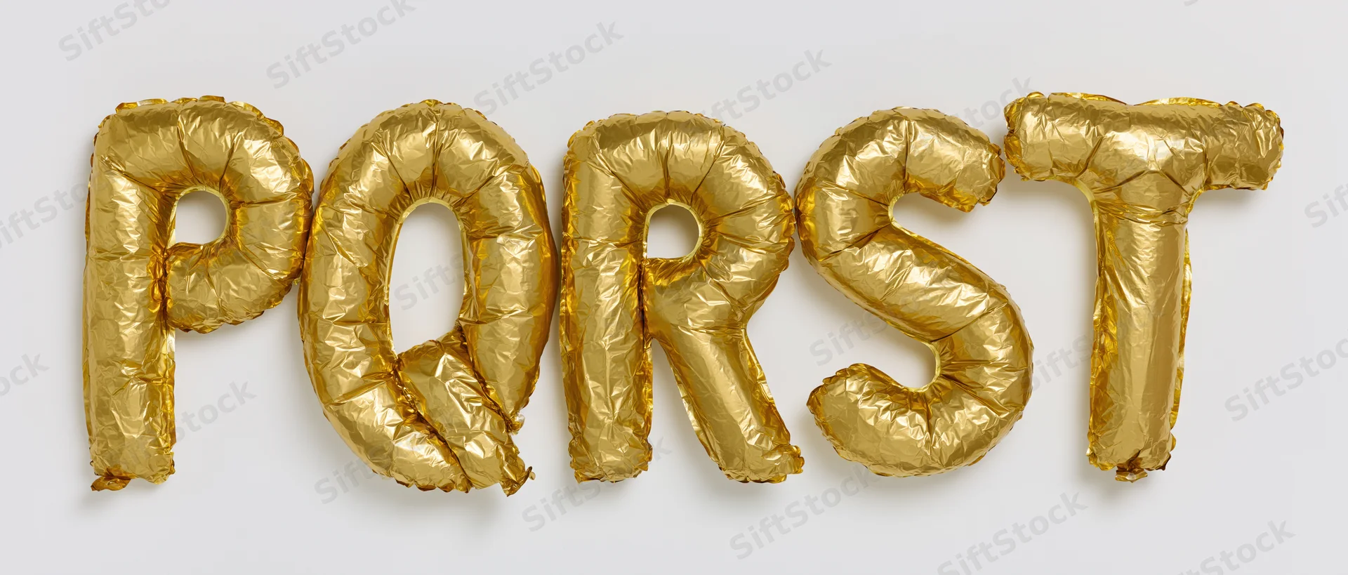 Gold mylar foil letter balloons spelling P Q R S T arranged in a row on a white background