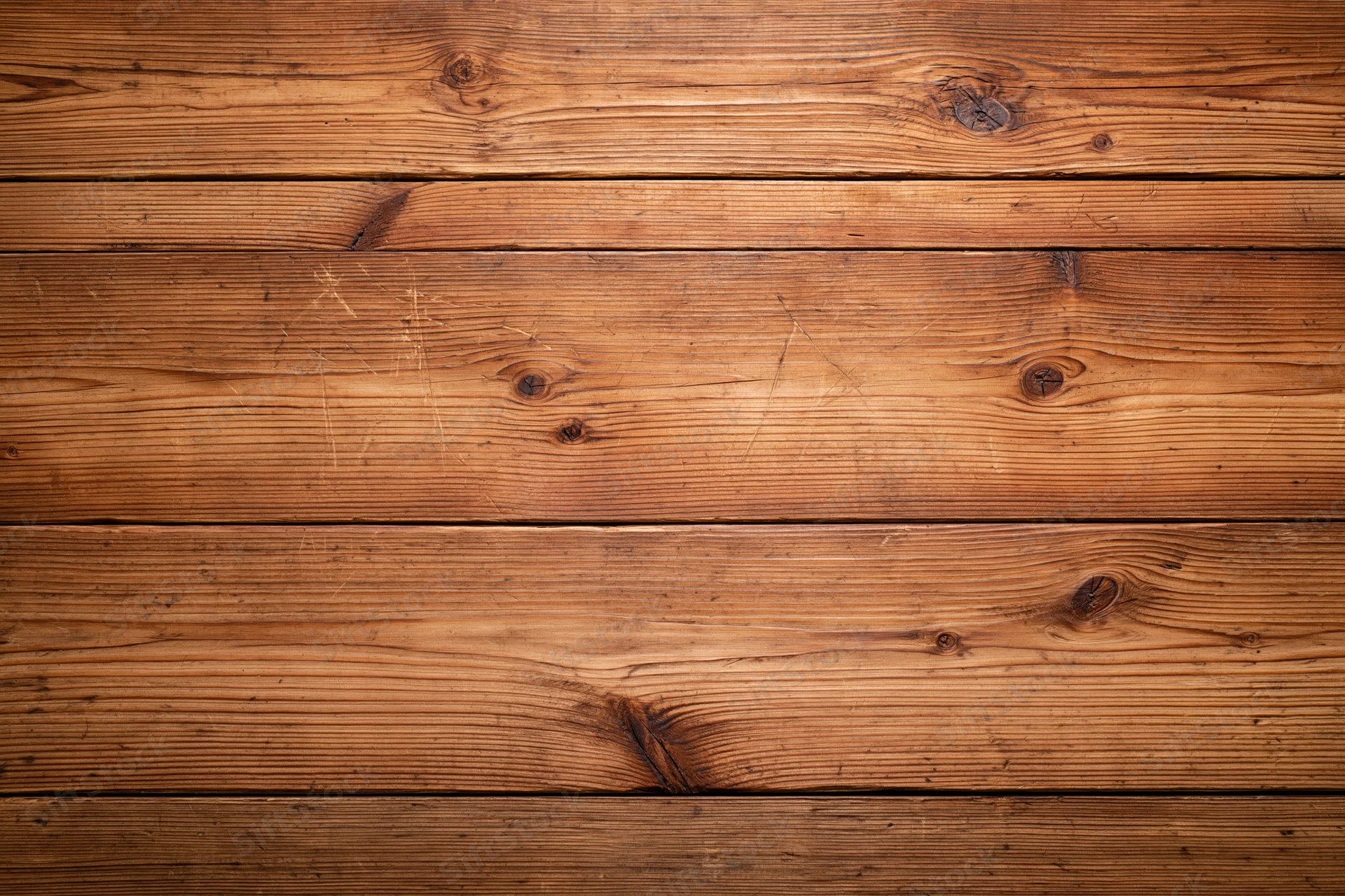 Horizontal wooden planks forming a textured surface with visible grain and knots