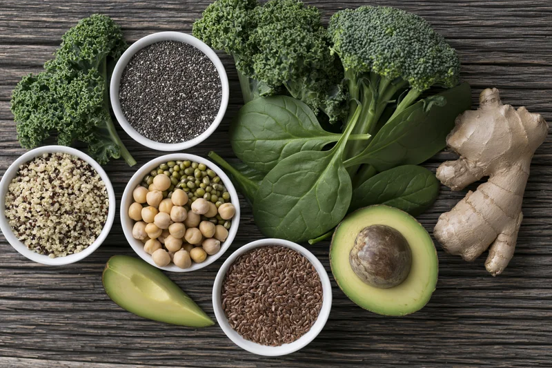 Assorted superfoods arranged on dark weathered wood surface