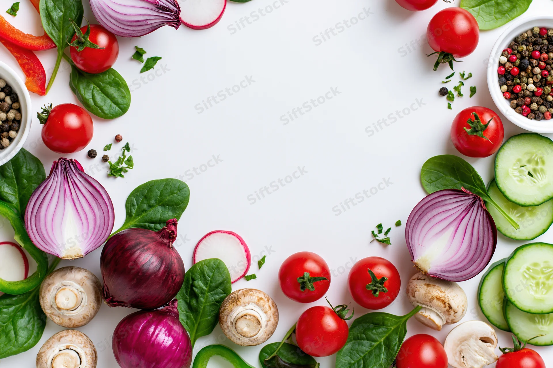 Fresh vegetables arranged in a border frame on white surface