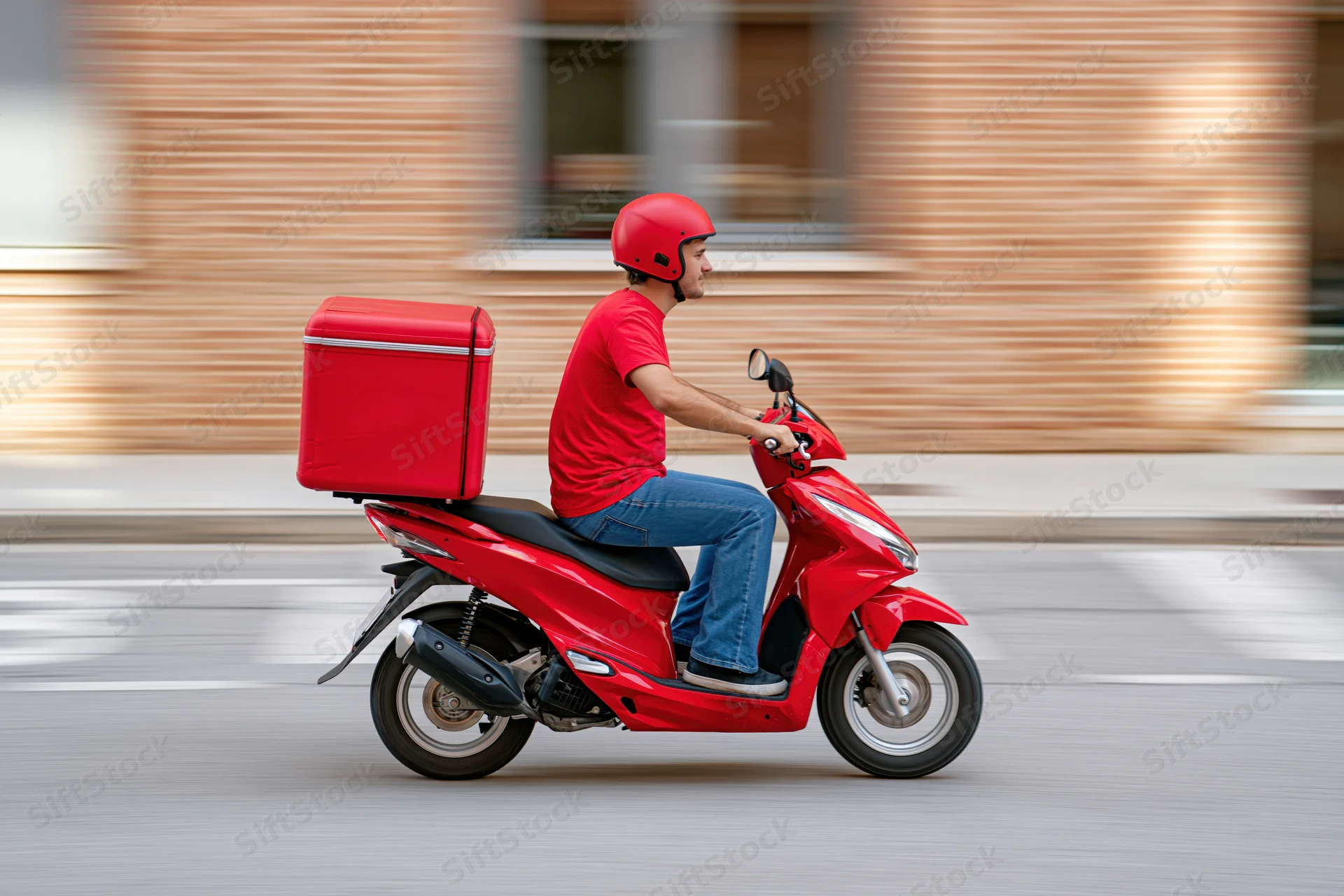 Delivery rider on red scooter speeding through city street