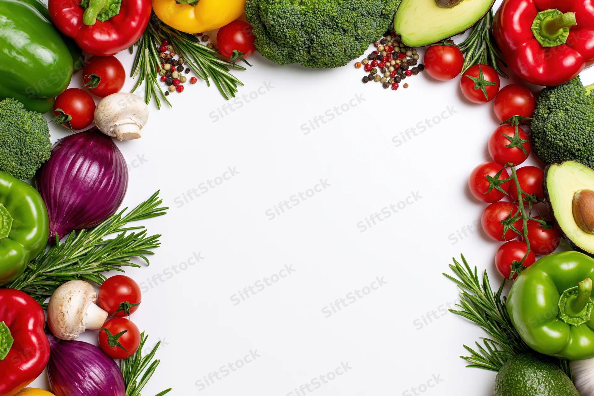Fresh vegetables and herbs arranged in a border frame on white background with copyspace