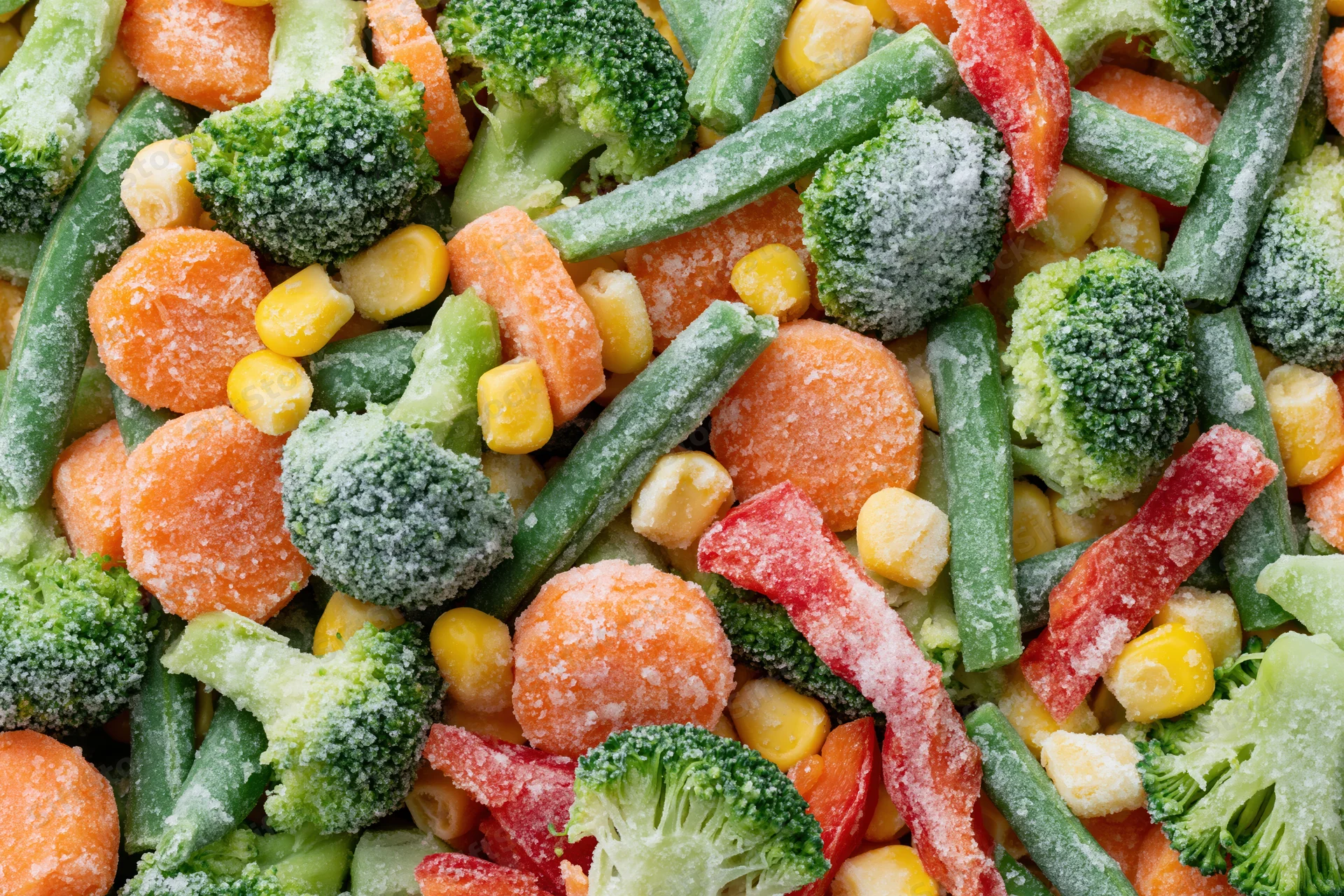Frozen mixed vegetables spread flat filling the frame