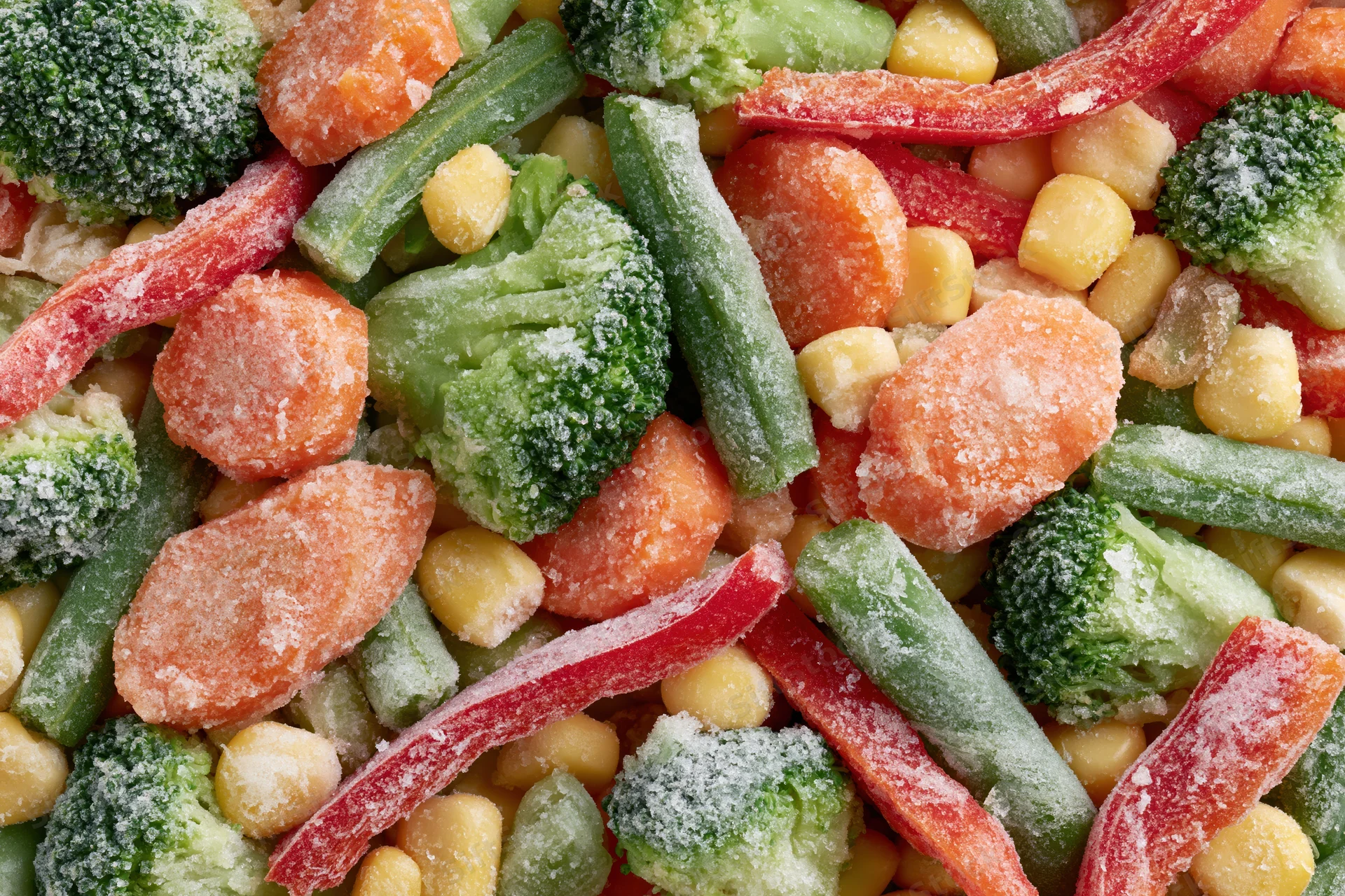 Frozen mixed vegetables spread flat filling the frame