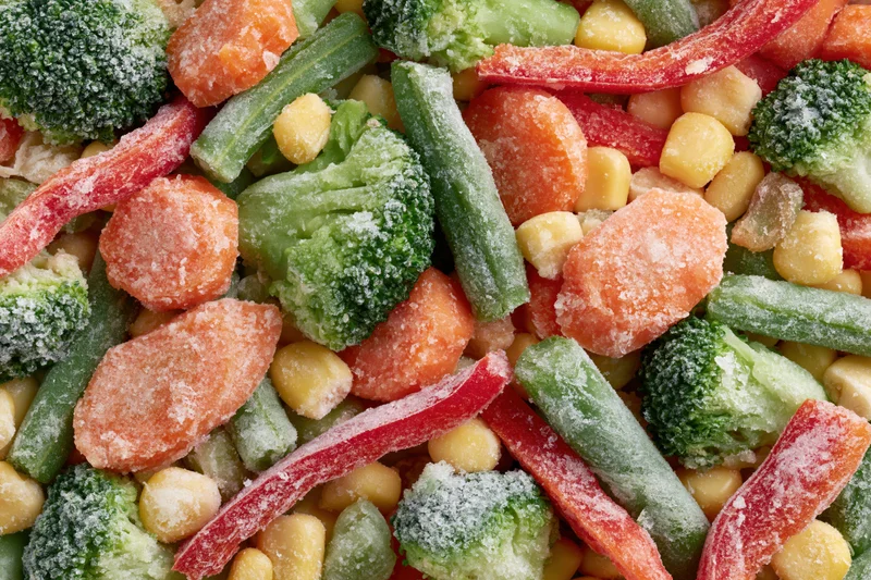 Frozen mixed vegetables spread flat filling the frame