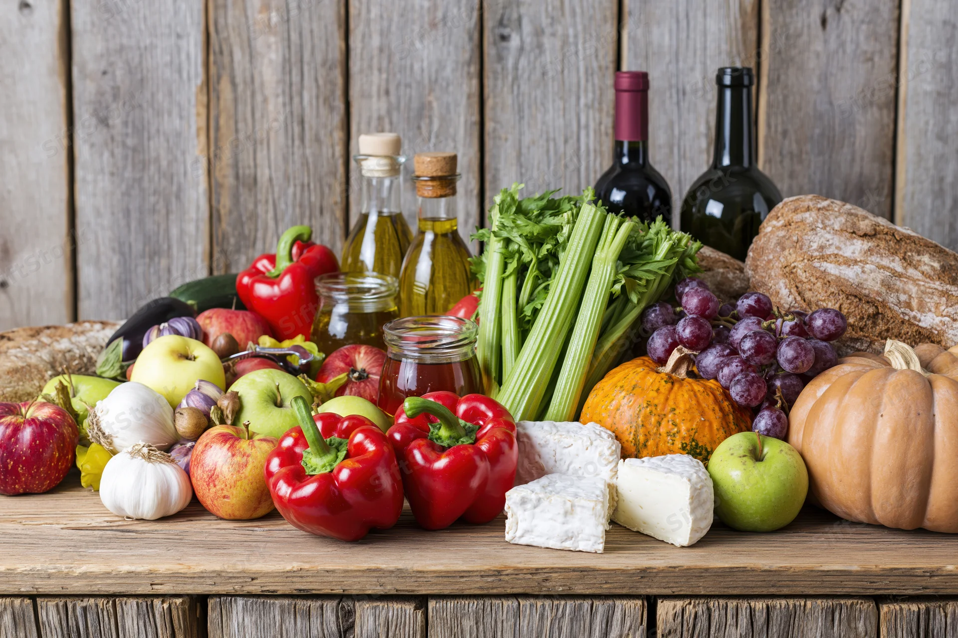 Fresh groceries arranged on a rustic wooden table