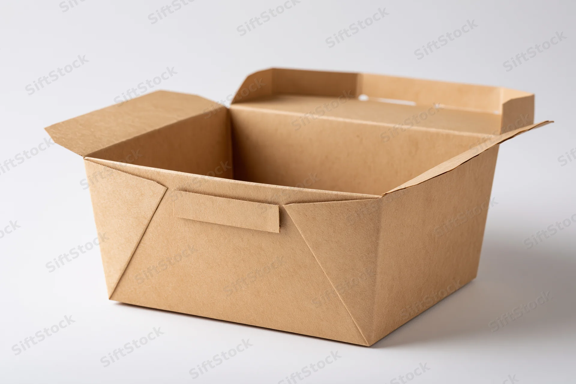 Open empty kraft cardboard takeout food box with lid propped upright on white background