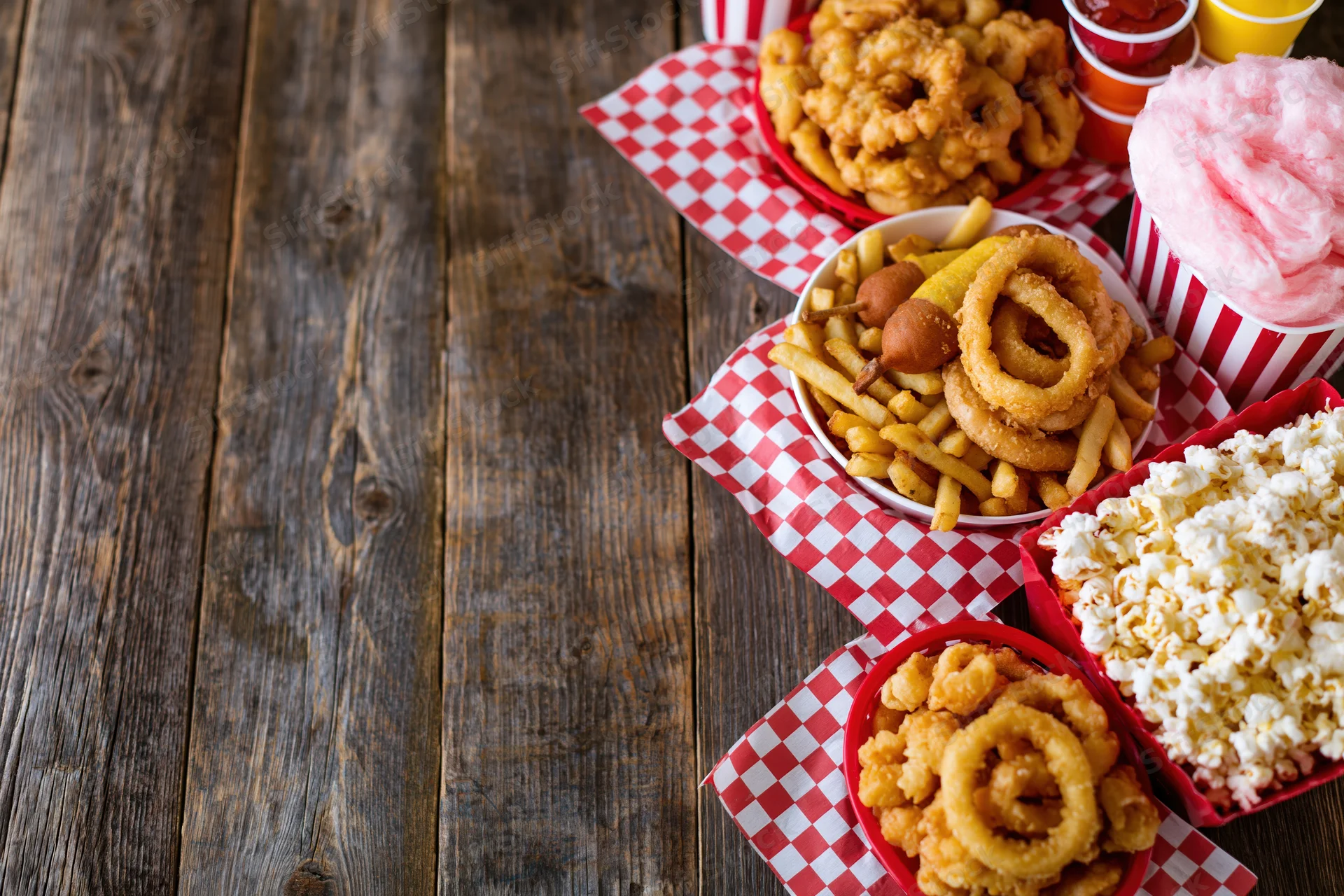 Classic american fair food spread arranged on wooden table with copyspace