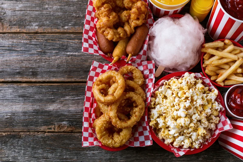 Overhead flat lay of classic American fair food spread arranged