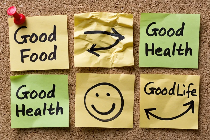 Six crumpled sticky notes with hand-written phrases and smiley face arranged in grid on corkboard