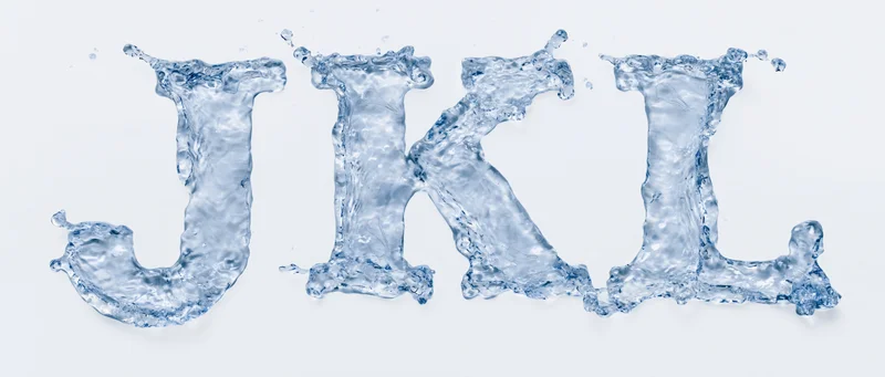 Water forming the letters J K L in a flowing splash against a white background
