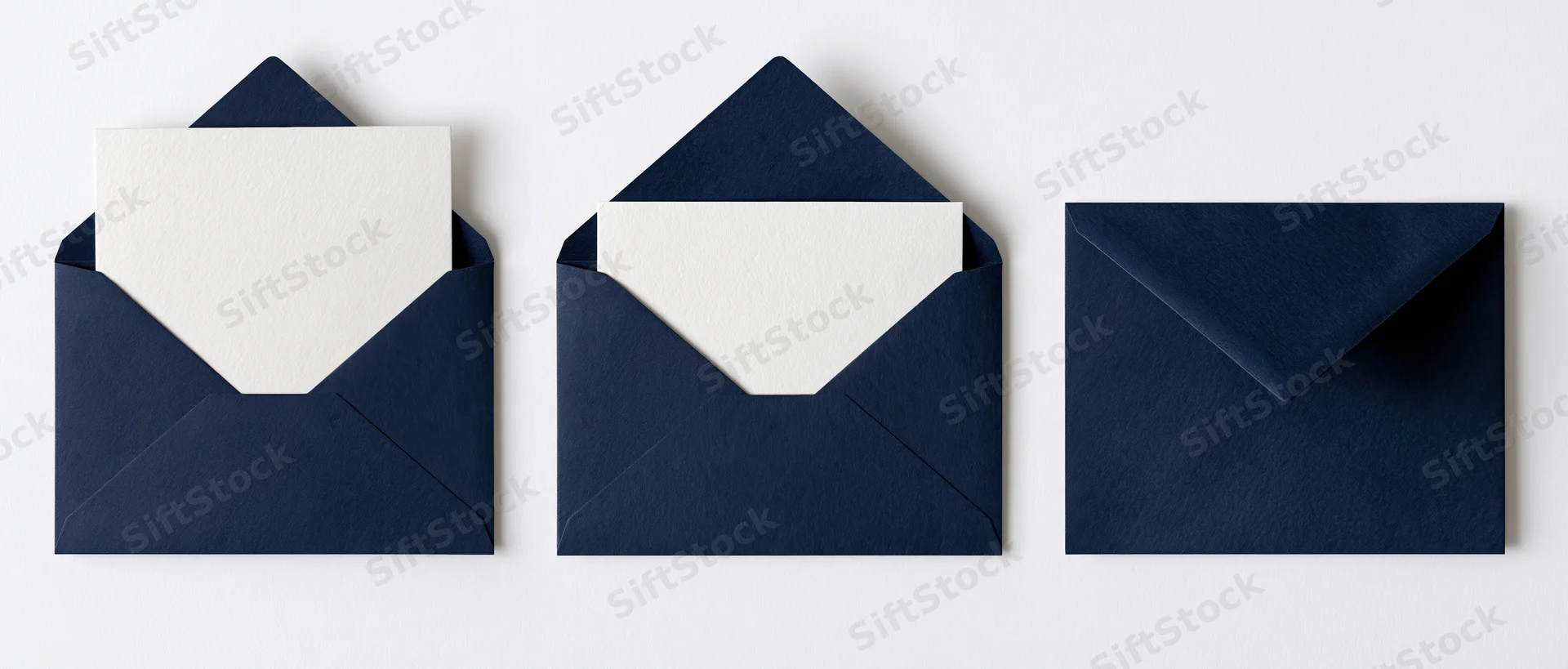 Three navy blue envelopes with white cards arranged in a row on a white surface