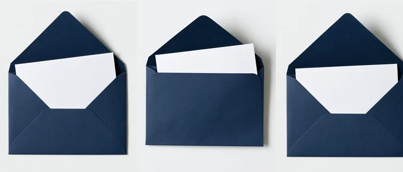 Three navy blue envelopes with blank white cards arranged side by side on white background