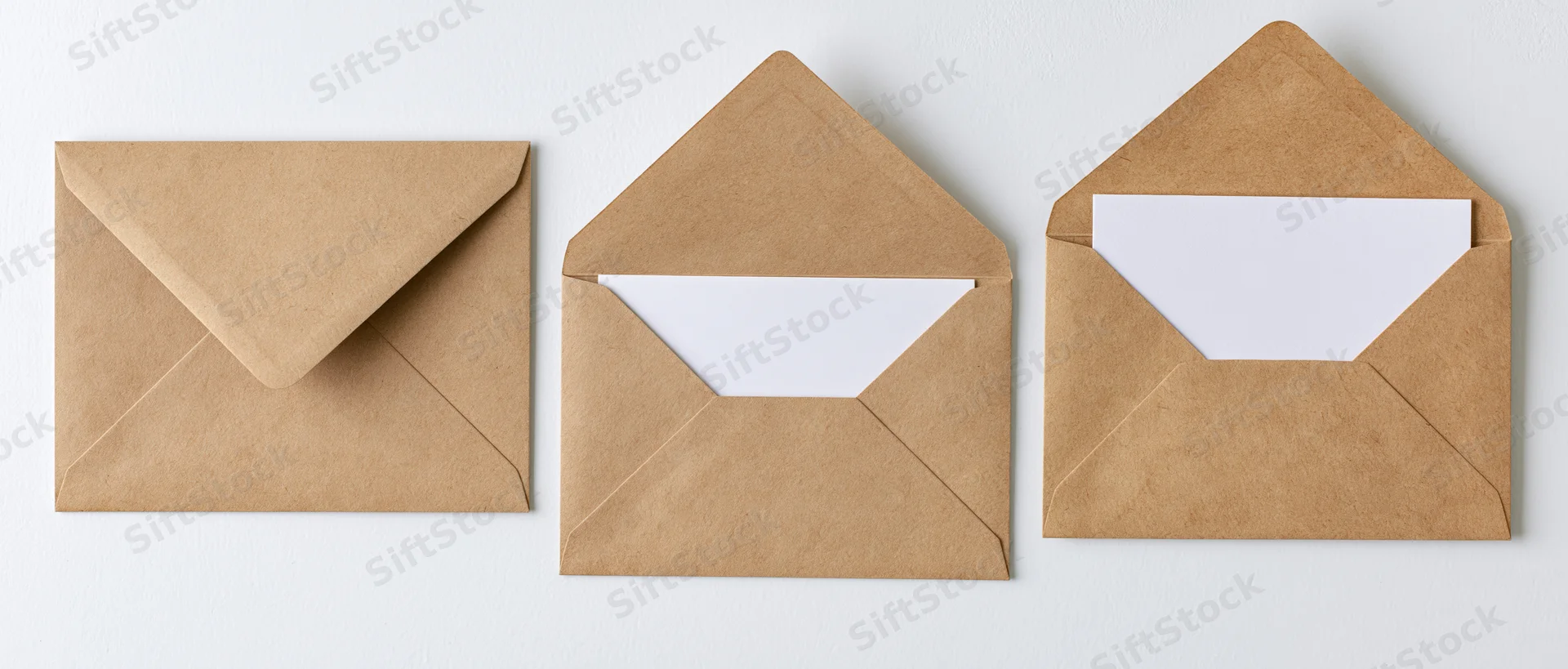 Three kraft paper envelopes arranged in a row, one closed and two open, on a white background