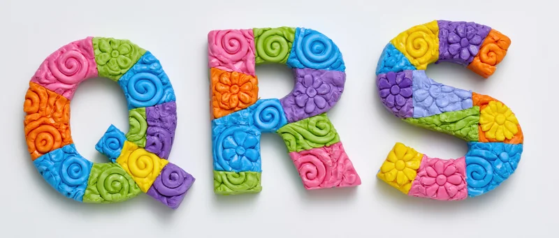 Three colorful sculpted letters q r s made of clay with floral and swirl patterns on white background