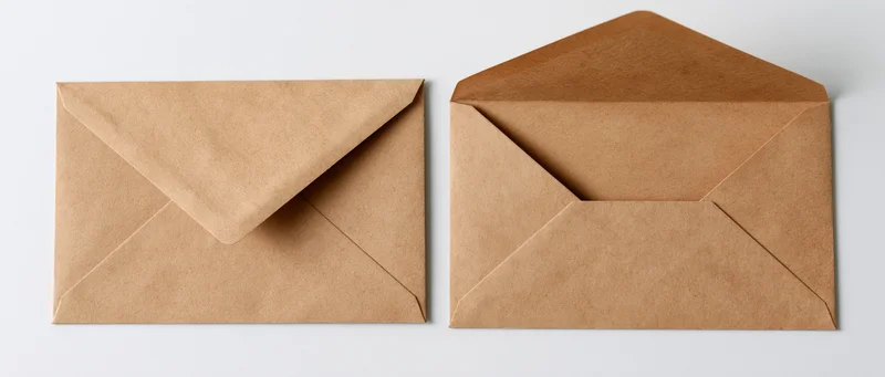 Two kraft paper envelopes side by side, one closed and one open, on a white background